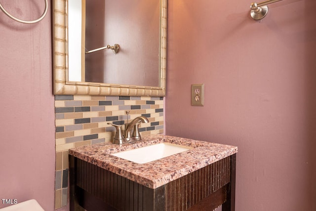 bathroom featuring backsplash and vanity