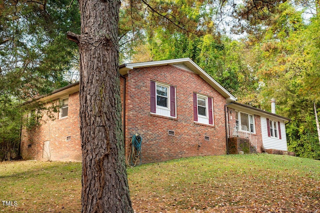 view of home's exterior with a lawn