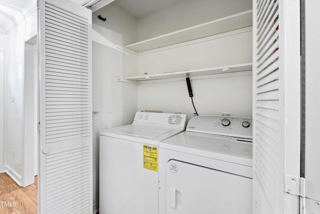 1321 Dylan Heath Ct, Raleigh, NC 27608 - laundry area featuring washing machine and dryer and light wood-type flooring