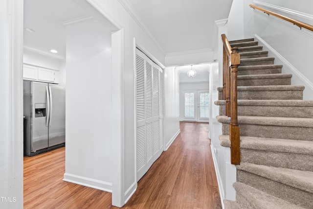 1321 Dylan Heath Ct, Raleigh, NC 27608 - staircase featuring wood finished floors, ornamental molding, and recessed lighting
