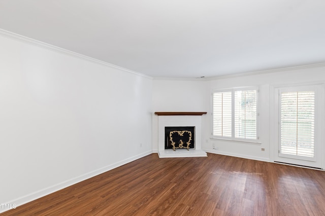 1321 Dylan Heath Ct, Raleigh, NC 27608 - unfurnished living room featuring dark wood-style floors, ornamental molding, and a fireplace with raised hearth