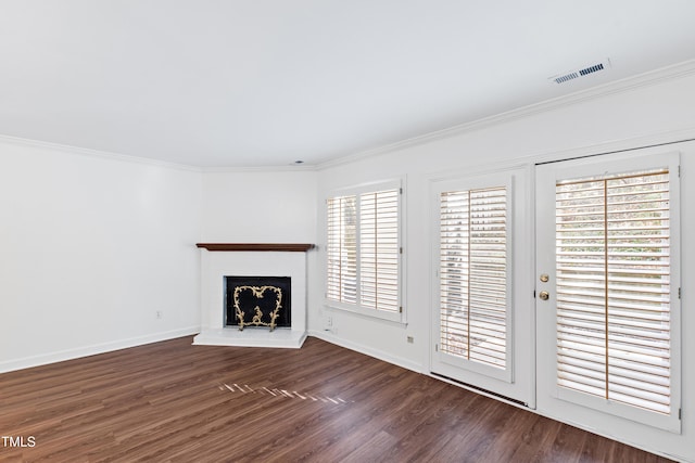 1321 Dylan Heath Ct, Raleigh, NC 27608 - unfurnished living room featuring crown molding, dark wood-type flooring, and a fireplace with raised hearth