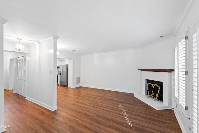 1321 Dylan Heath Ct, Raleigh, NC 27608 - unfurnished living room featuring ornamental molding, dark wood-style floors, and a fireplace