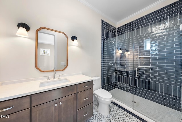 bathroom featuring an enclosed shower, vanity, toilet, and crown molding