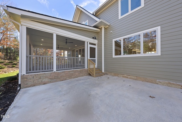 view of patio featuring a sunroom