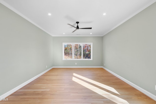 unfurnished room with ceiling fan, light hardwood / wood-style floors, and crown molding