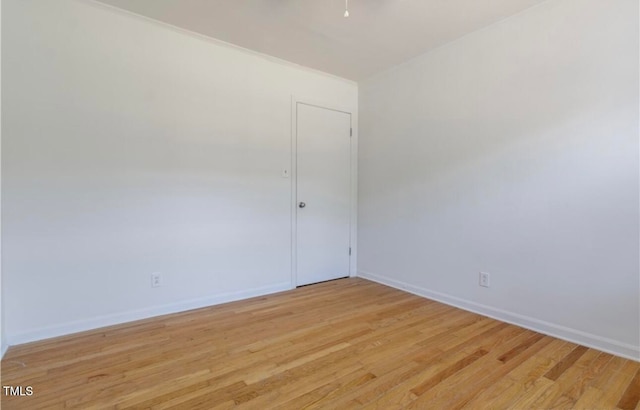 spare room featuring light wood-type flooring