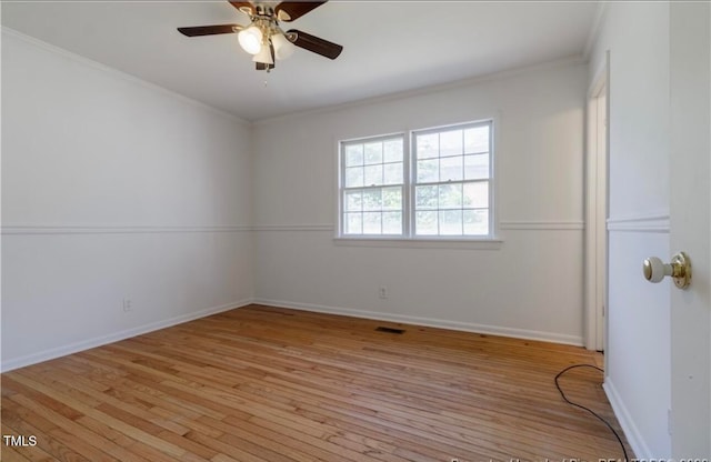 empty room featuring light hardwood / wood-style floors, ceiling fan, and ornamental molding