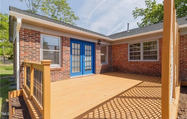 wooden deck featuring french doors