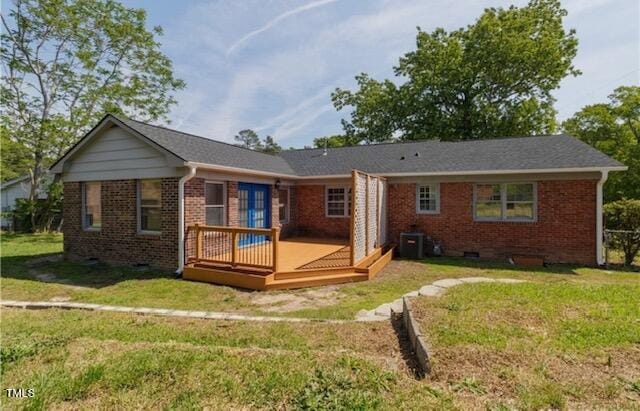 back of house featuring a yard and a deck