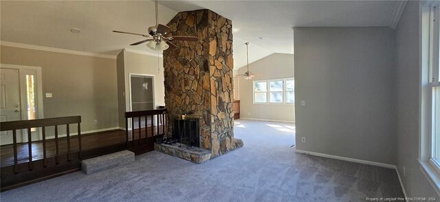 carpeted living room featuring a stone fireplace, ceiling fan, high vaulted ceiling, and ornamental molding