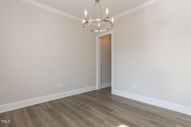 empty room featuring dark wood-style floors, baseboards, a chandelier, and crown molding