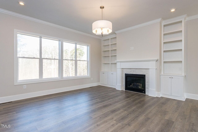 unfurnished living room with a fireplace, ornamental molding, and dark wood-type flooring