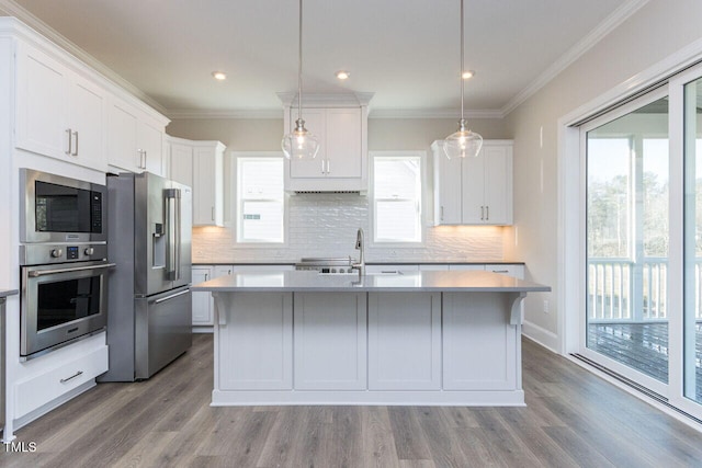 kitchen featuring stainless steel appliances, a sink, light countertops, and white cabinetry