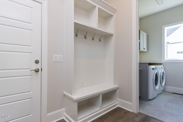 mudroom featuring visible vents, baseboards, washer and clothes dryer, and dark wood-type flooring