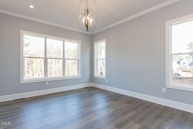 unfurnished room featuring ornamental molding, dark wood-style flooring, and an inviting chandelier