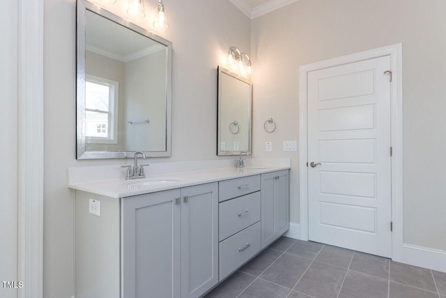 full bathroom with ornamental molding, double vanity, a sink, and tile patterned floors