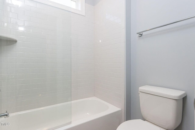 bathroom featuring toilet and  shower combination