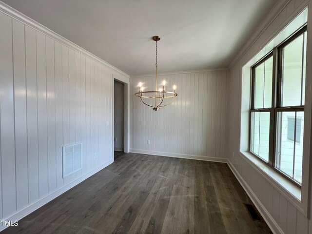 6040 Scalybark Rd, Durham, NC 27712 - unfurnished dining area featuring a chandelier, dark wood-type flooring, crown molding, and baseboards