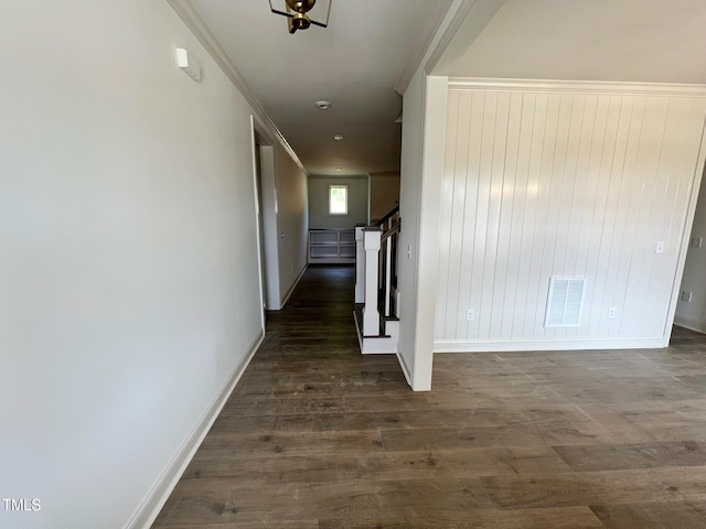 6040 Scalybark Rd, Durham, NC 27712 - hallway featuring dark wood finished floors, baseboards, and ornamental molding