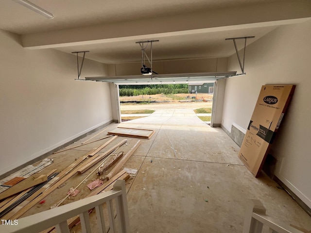 6040 Scalybark Rd, Durham, NC 27712 - garage with a garage door opener and baseboards