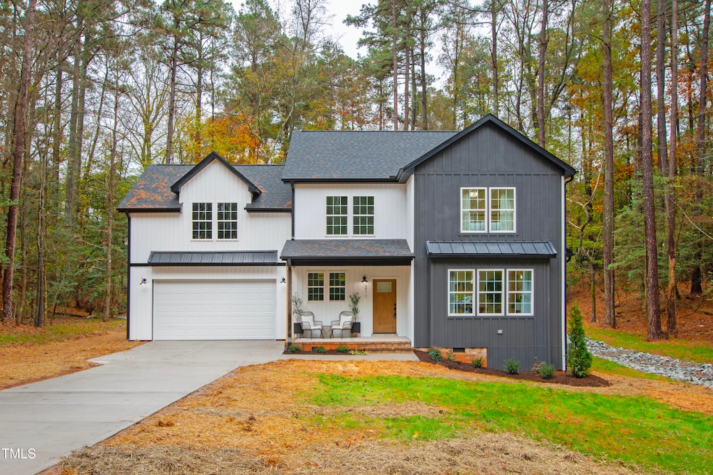 view of front of house featuring covered porch and a garage