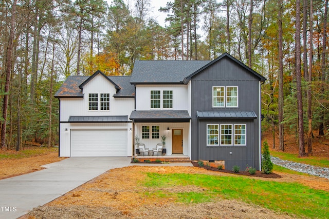 view of front of house featuring covered porch and a garage