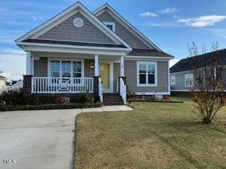 view of front of home featuring a porch and a front yard