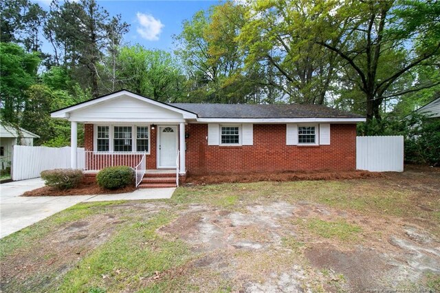 ranch-style home with covered porch