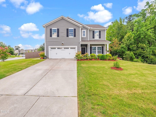 view of front of home featuring a garage and a front lawn