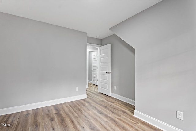 additional living space featuring light hardwood / wood-style flooring