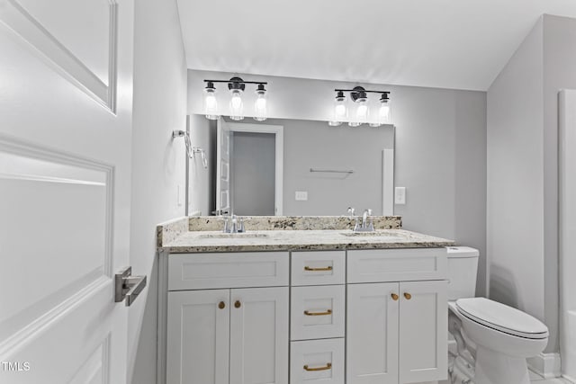 bathroom with vanity and toilet