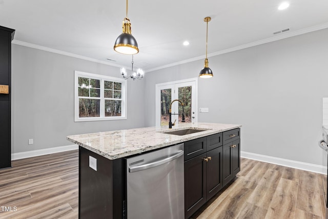 kitchen featuring dishwasher, light wood-type flooring, a center island with sink, and sink