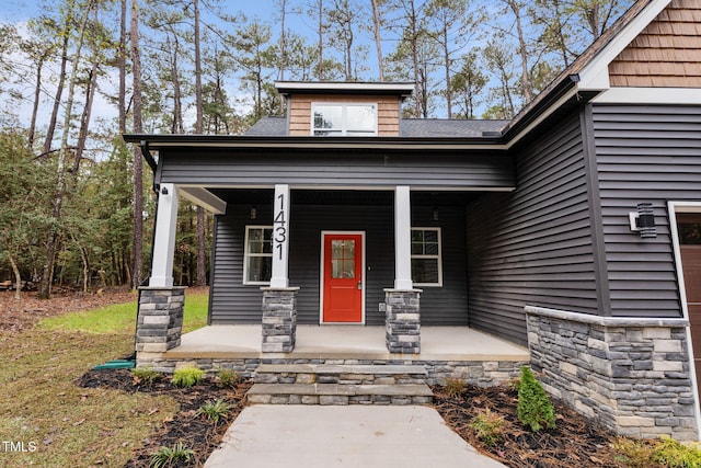 entrance to property featuring covered porch