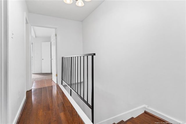 corridor with dark hardwood / wood-style floors