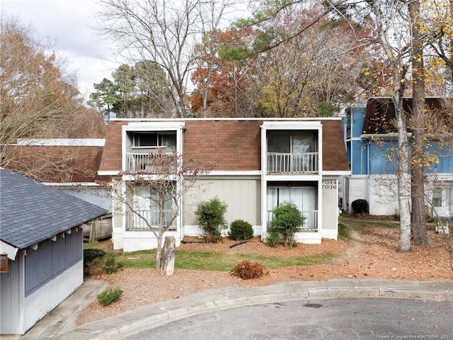 view of front of house featuring a balcony