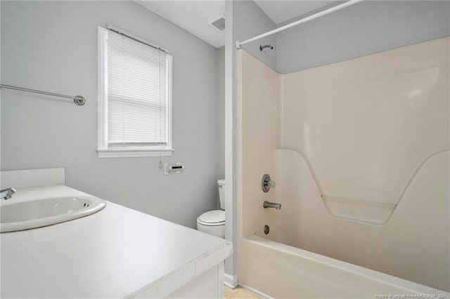 full bathroom with vanity, toilet, and bathtub / shower combination