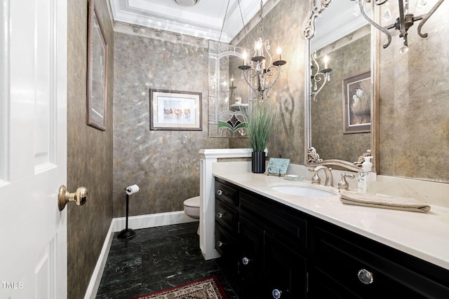 bathroom featuring vanity, ornamental molding, and toilet