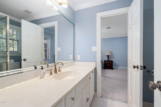 bathroom with vanity, tile patterned floors, and crown molding