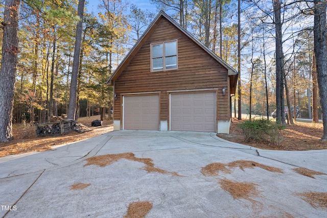 view of home's exterior featuring a garage and an outdoor structure