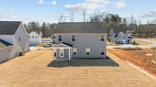 view of front facade featuring central AC