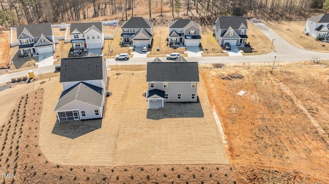 birds eye view of property with a residential view