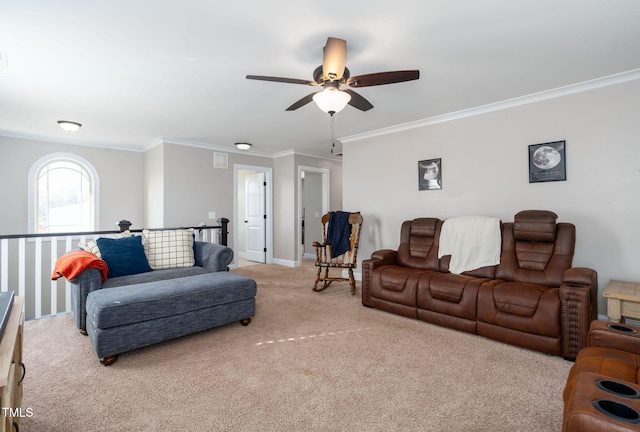 carpeted living room with ceiling fan and ornamental molding