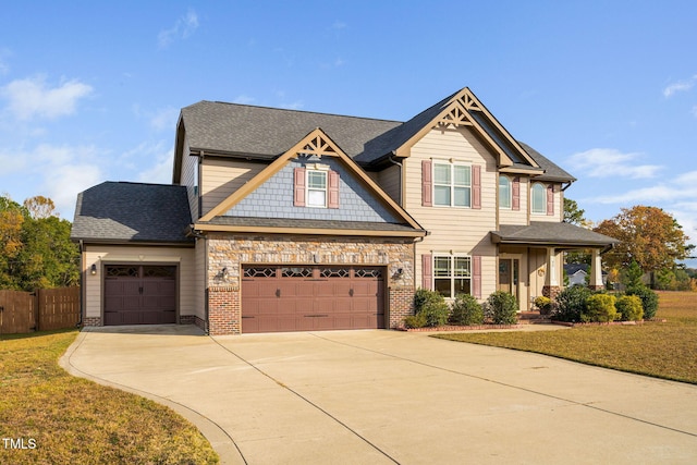 craftsman-style home with a front lawn and a garage