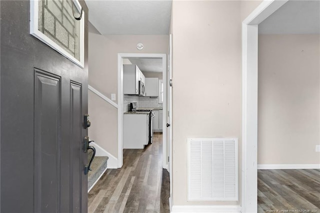 foyer featuring dark hardwood / wood-style floors