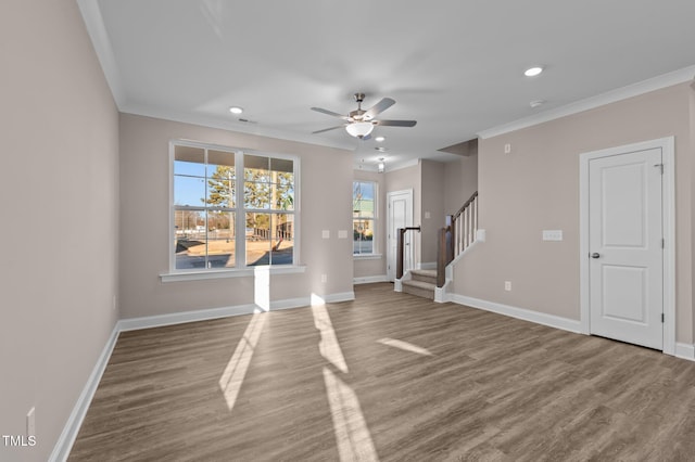 unfurnished room featuring ceiling fan, hardwood / wood-style floors, and ornamental molding