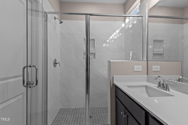 bathroom featuring vanity and walk in shower