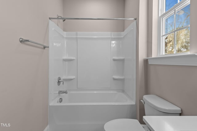 bathroom with toilet and shower / bath combination