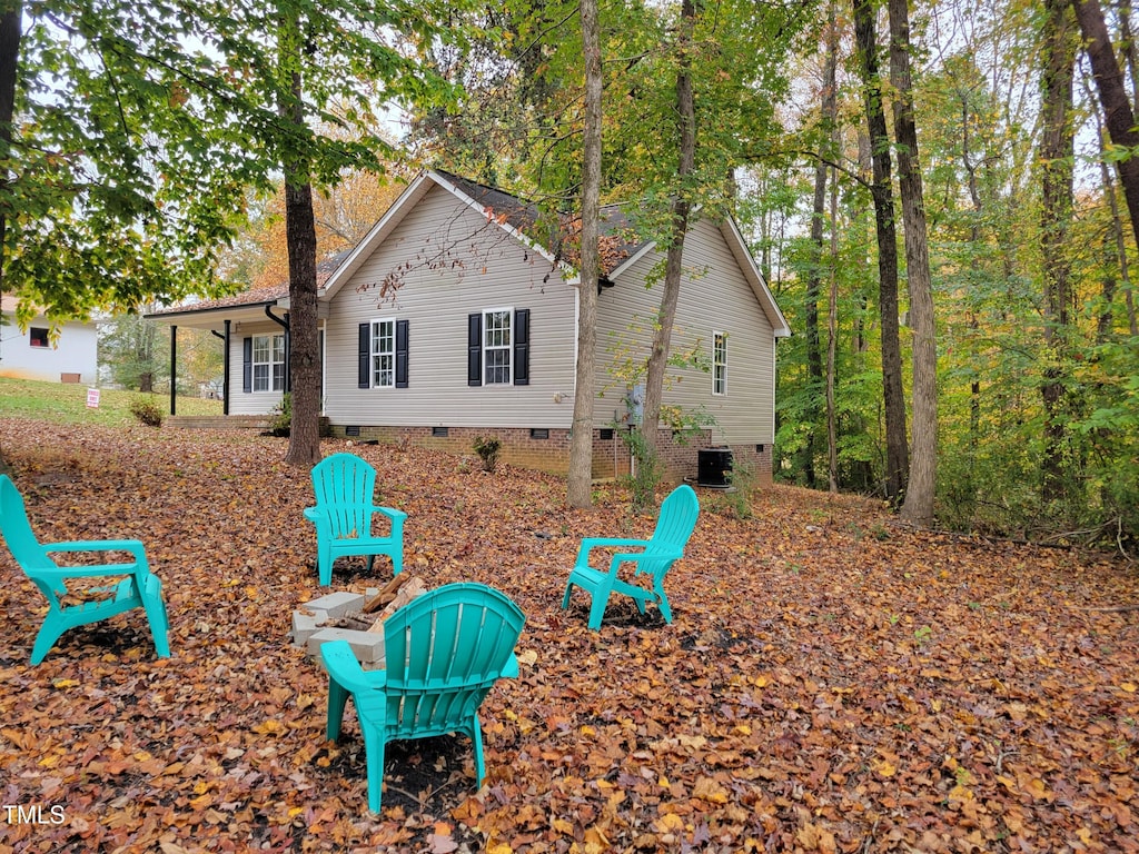 back of property featuring central air condition unit