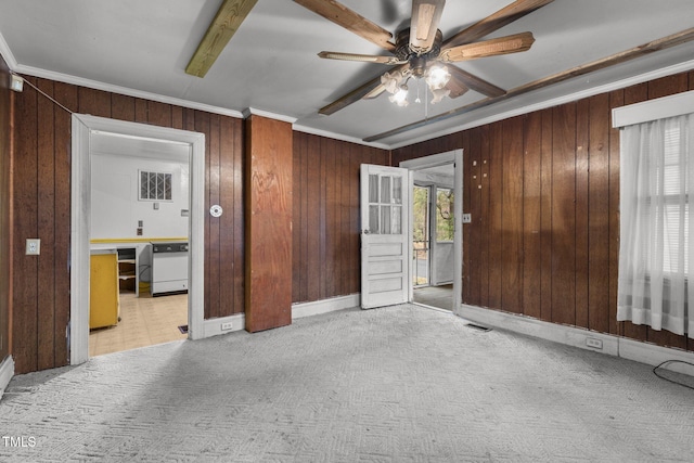 unfurnished bedroom with ceiling fan, crown molding, light carpet, and multiple windows